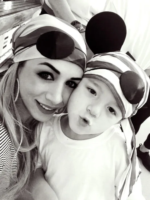 Jacqui Berardi, owner of Players Sports Bar & Grille, with her son Nico