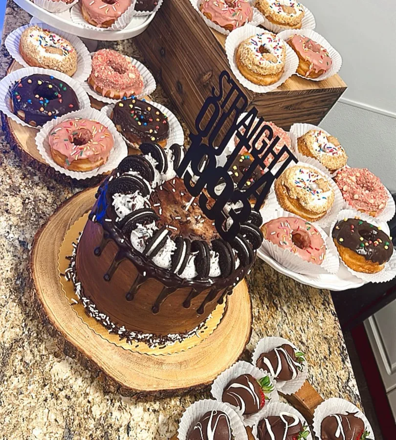 Catered dessert spread of cake and donuts
