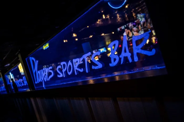 Players Sports Bar neon sign above the bar