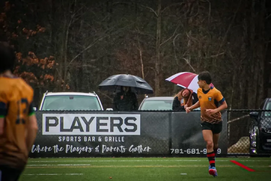 Players Sports Bar & Grille sponsorship banner at a local youth sports field